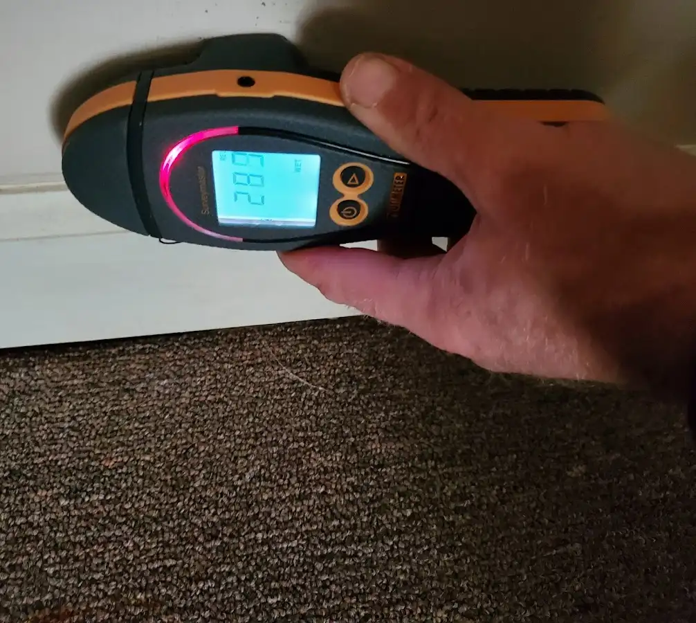 Moisture detection at baseboard during Storm Damage Restoration in Berkeley Heights